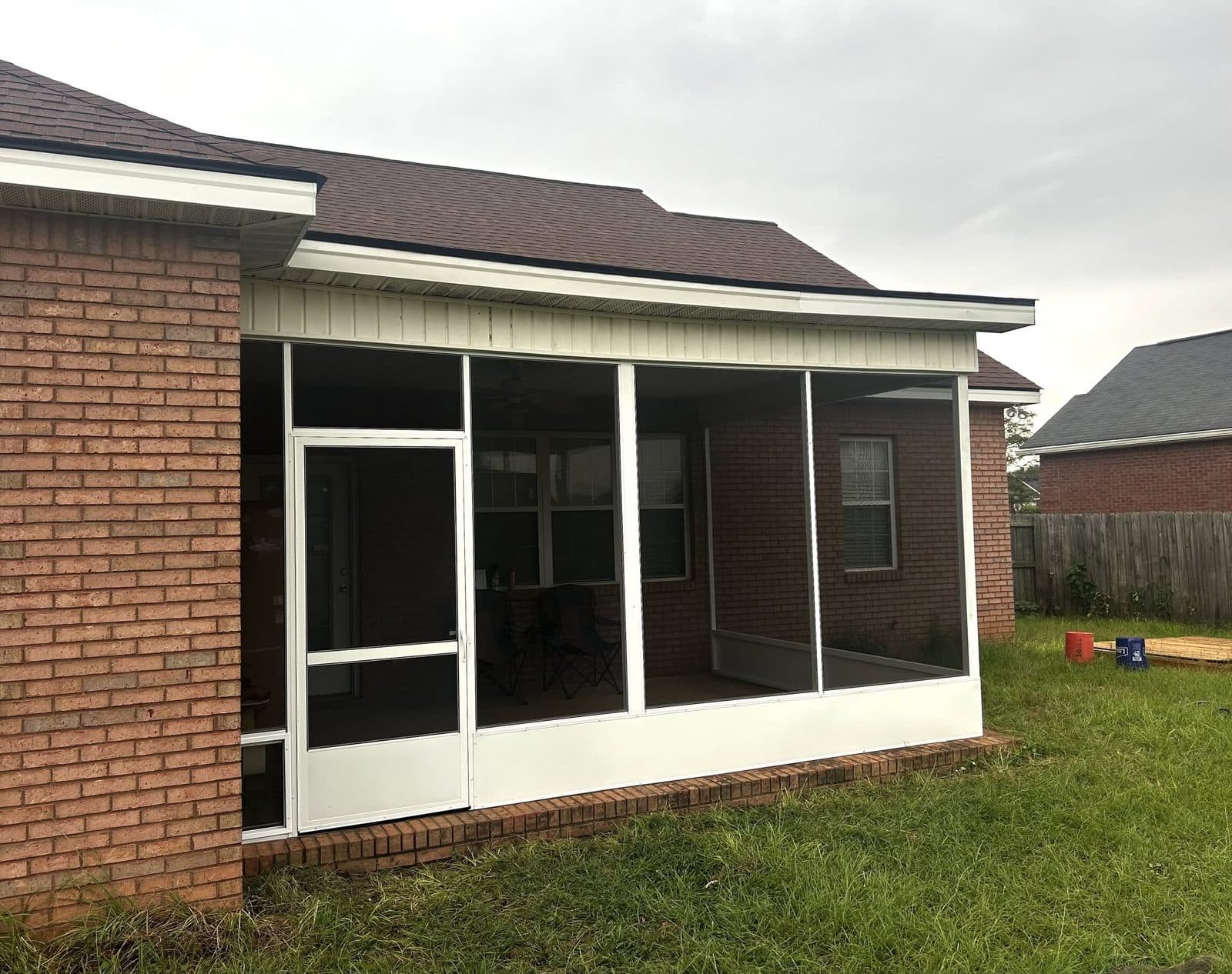Finished screened porch addition with white trim